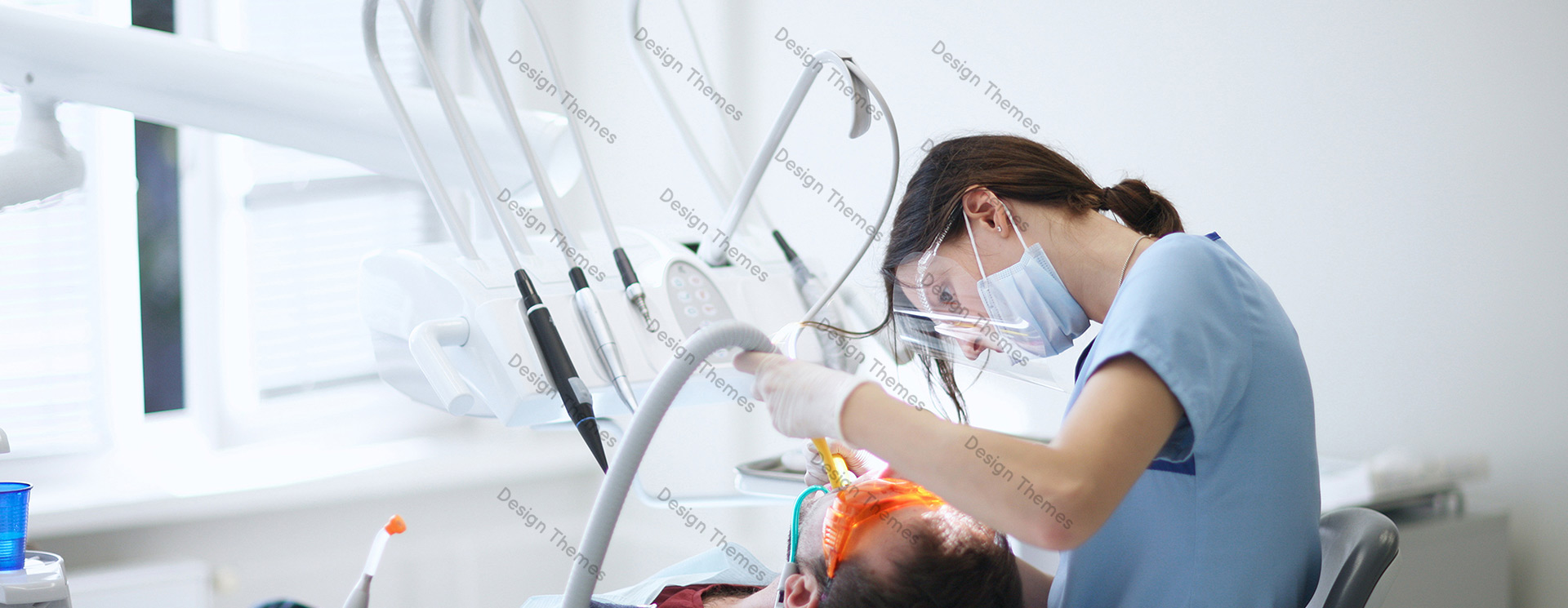 a female dentist performing a treatment