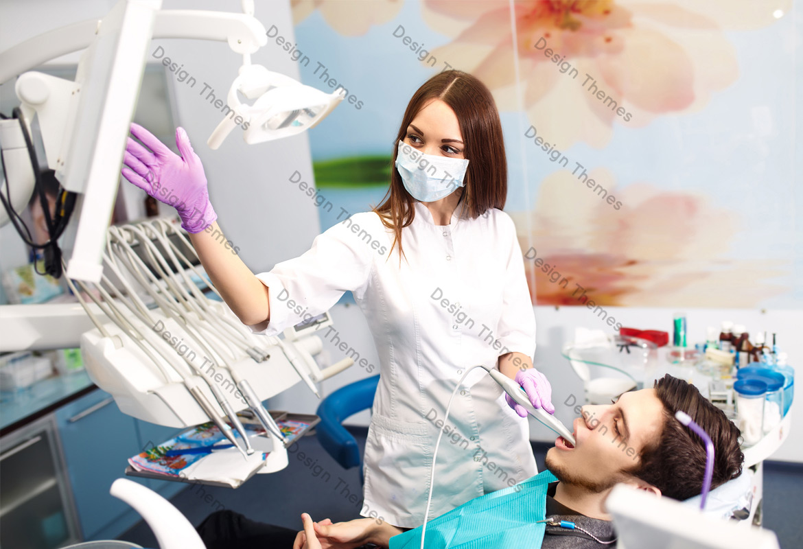 a woman dentist and a patient looking at a screen