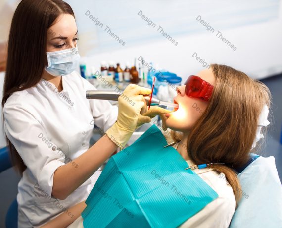 a woman dentist performing a treatment on a patient