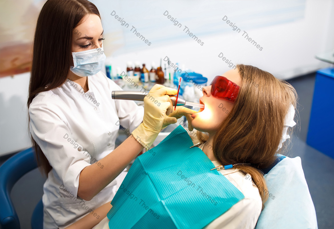 a woman dentist performing a treatment on a patient