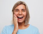 Cheerful beautiful young woman with blonde hair