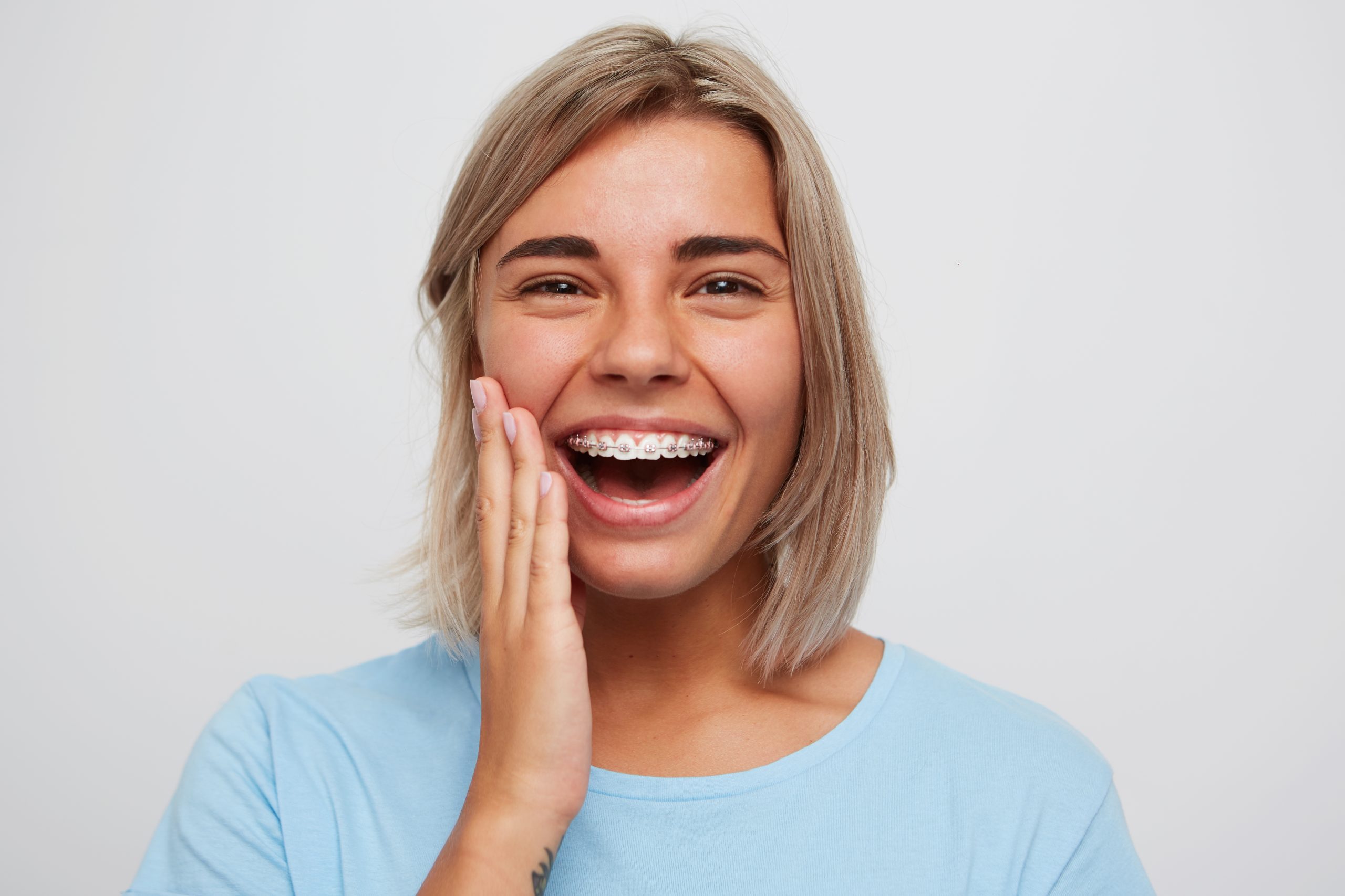 Cheerful beautiful young woman with blonde hair